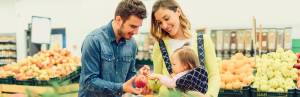 Parents shop for plant diversity with child