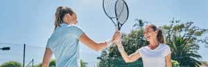 Navigating Perimenopause 2 Ladies-tennis-high-five