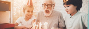 Healthspan vs Lifespan: Prioritizing Quality of Life Over Quantity 2 grandpa senior blows out candles with grandkids_healthspan