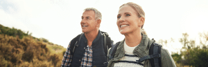 How Stress Impacts Health Span and Strategies to Moderate It 2 Reduce-stress-increase-health-span-two-hikers-smile