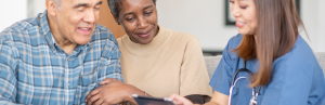 The Modern Science of Longevity: Living Better for Longer 2 senior couple looks at longevity health care plan with doctor
